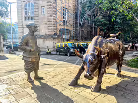 Charging Bull and Common man sculpture